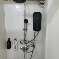 a rainshower with a black instant Heater Set