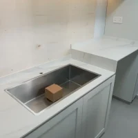 Single Large Kitchen Sink flush countertop finish with waste trap